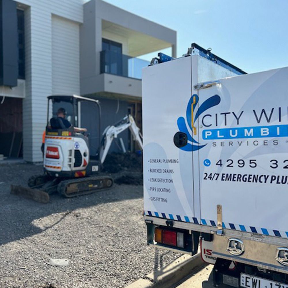 Excavator next to a CityWide truck on a new build